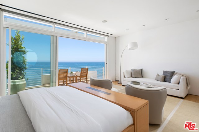 Bedroom in a $58,500,000 Malibu home for sale